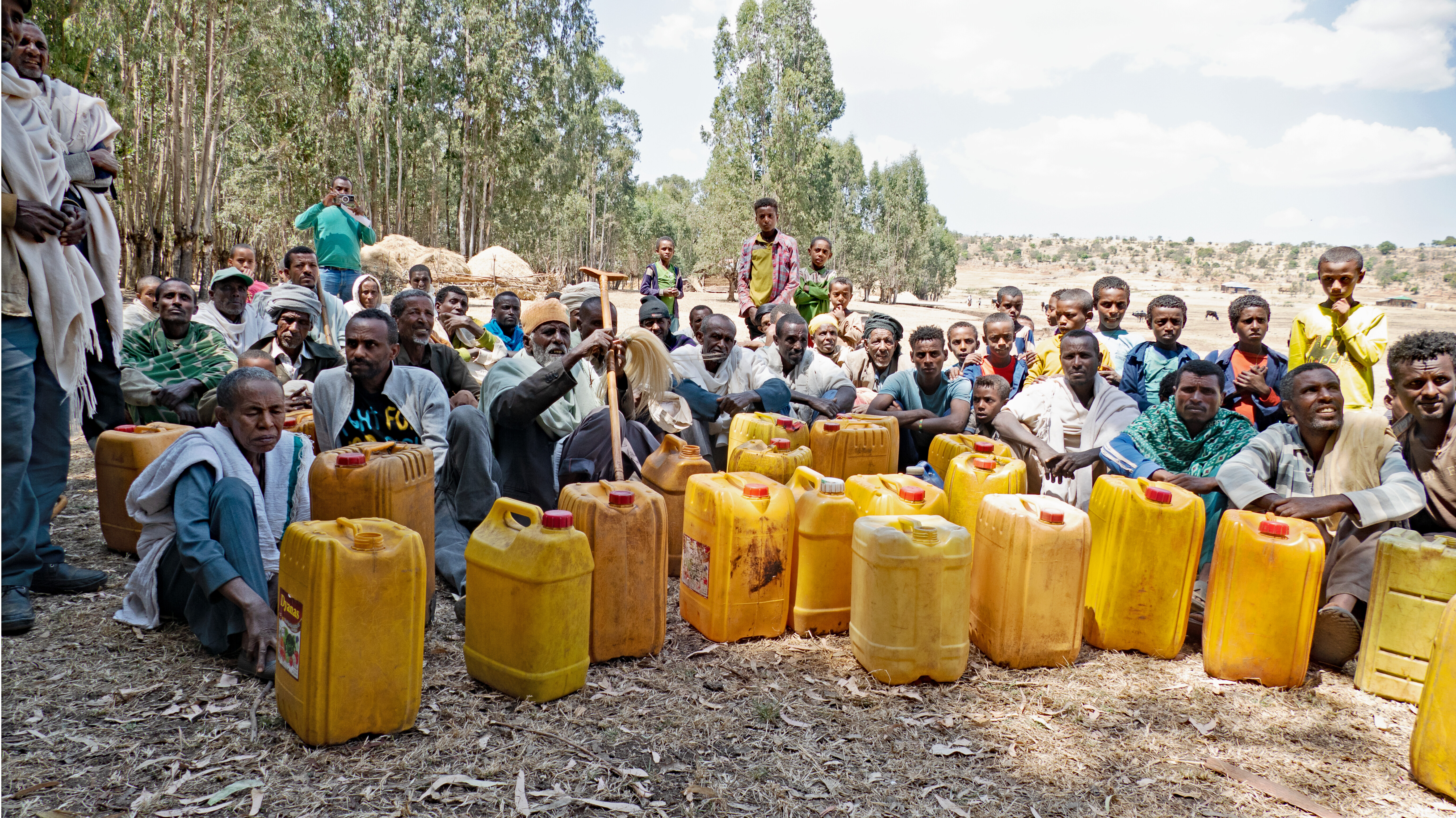 In this picture of people in a village in Abchekli Kabele, Ethiopia, community members gather to explain the acute need for clean water in this community.