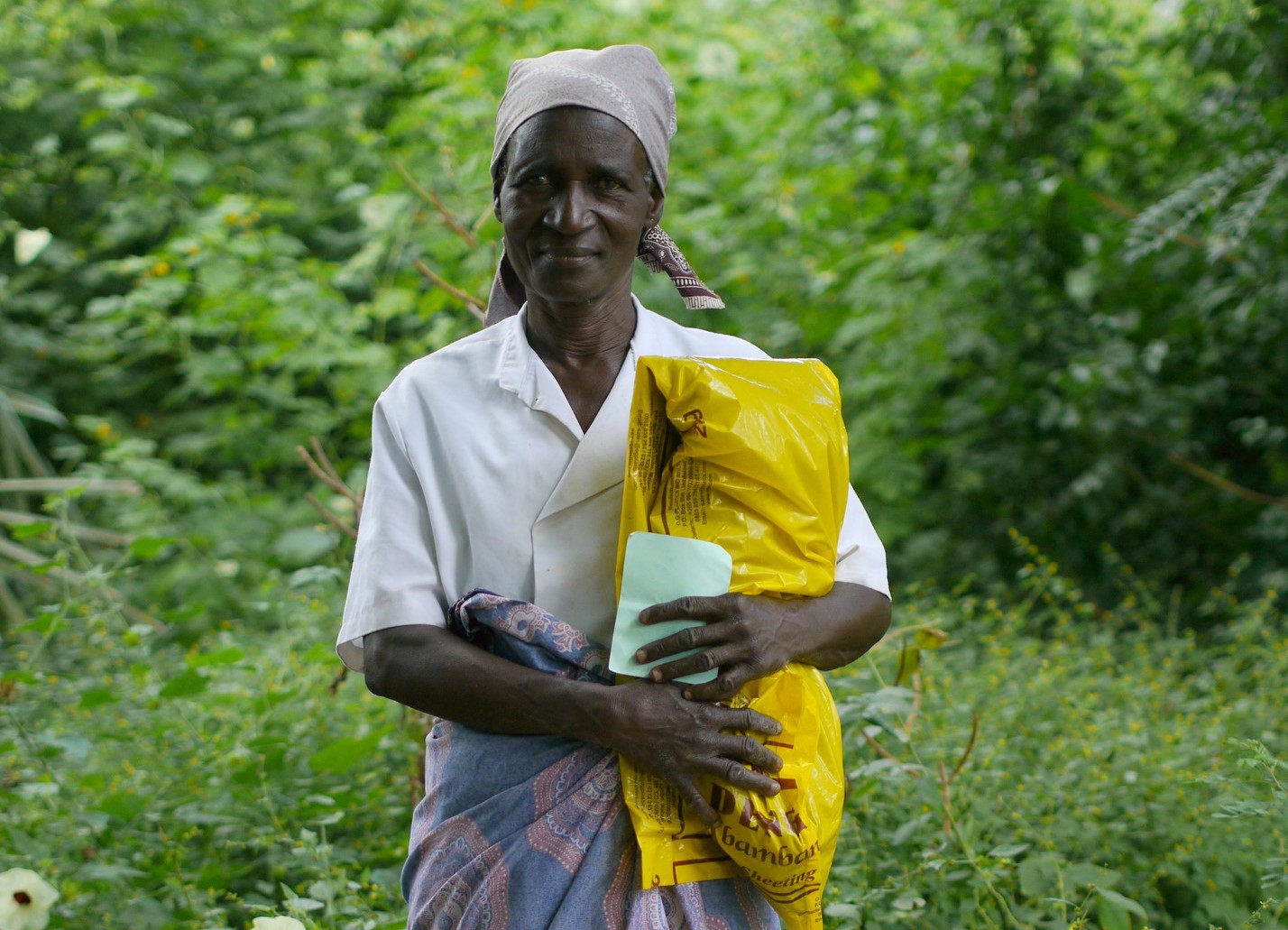 A woman holding a bag of emergency food
