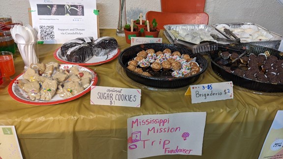 A table with various baked goods for sale