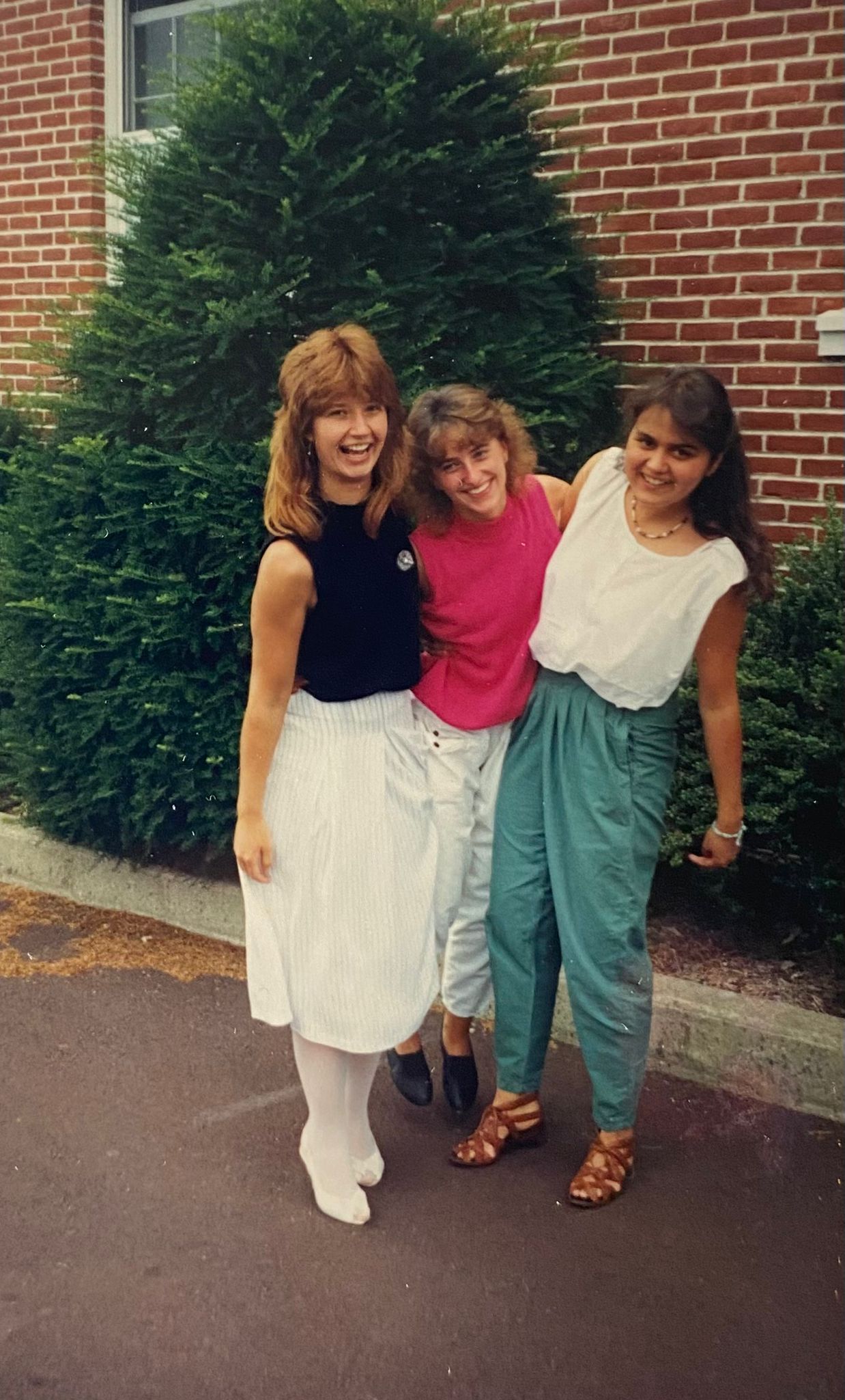 Three young woman standing for a photo