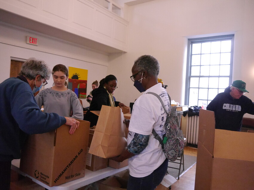 Janice Barbour (center), from Christian Stronghold Baptist Church in Philadelphia, packs an MCC prison care kit at MCC’s MLK service day at Germantown Mennonite Church (Philadelphia, Pa.) in January
